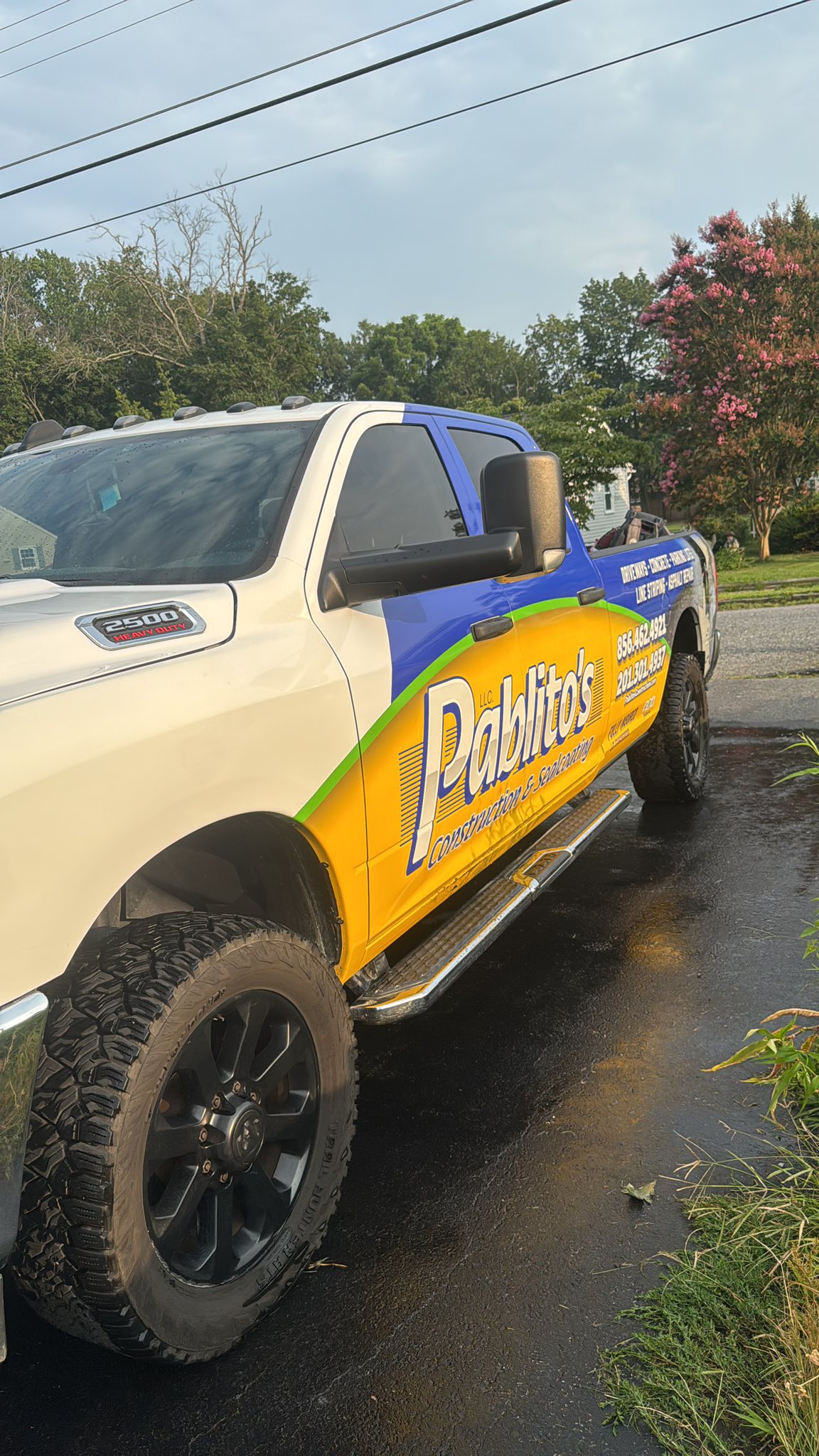 Pablito's branded work truck on driveway